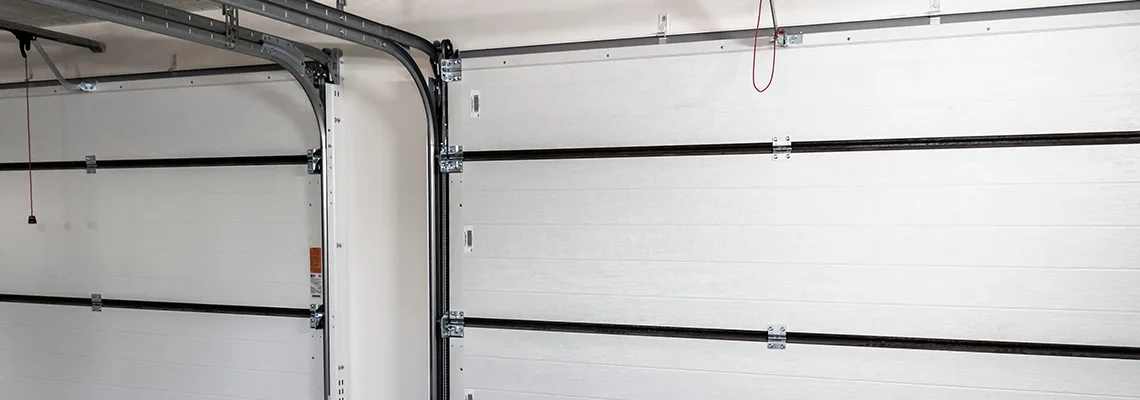 Fix Folding Garage Door Jerking in Winnipeg, Manitoba