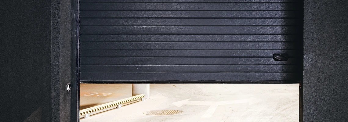 Residential Black Garage Door Installation in Winnipeg, MB